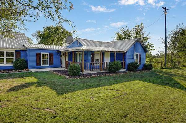 1.5 Acres of Residential Land with Home for Sale in La Russell, Missouri