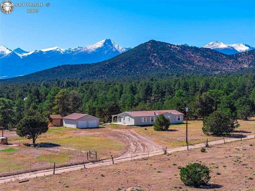 9 Acres of Land with Home for Sale in Cotopaxi, Colorado