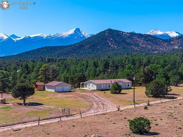 9 Acres of Residential Land with Home for Sale in Cotopaxi, Colorado