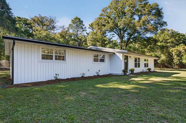 2.5 Acres of Residential Land with Home for Sale in Holt, Florida