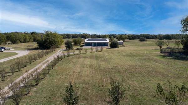7.43 Acres of Land with Home for Sale in Quinlan, Texas