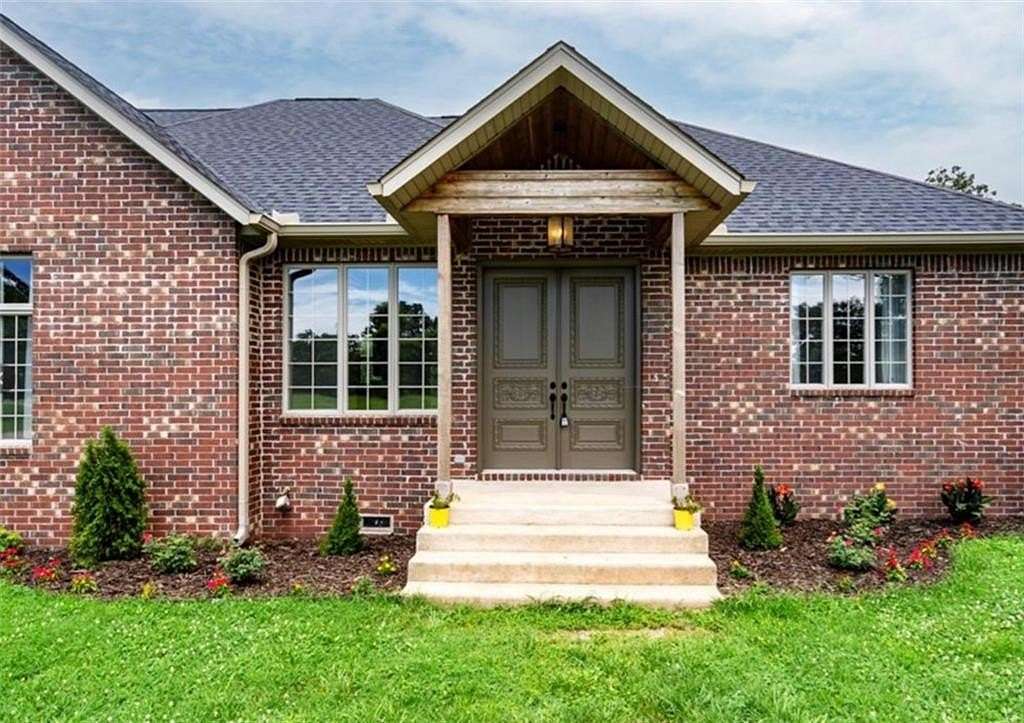 10.8 Acres of Land with Home for Sale in Gravette, Arkansas