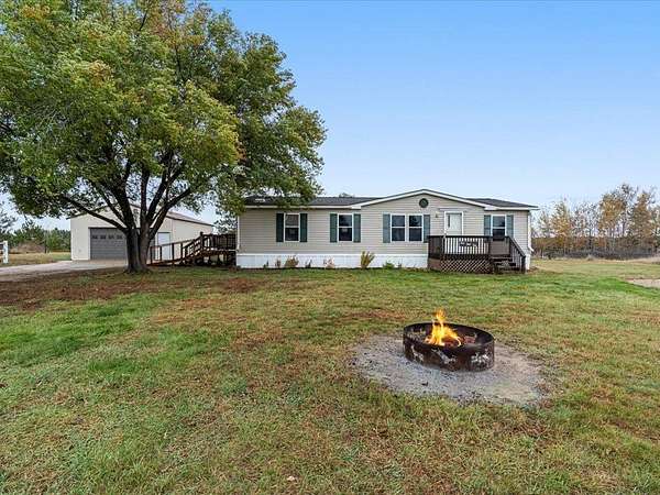 5 Acres of Residential Land with Home for Sale in Sylvan Township, Minnesota