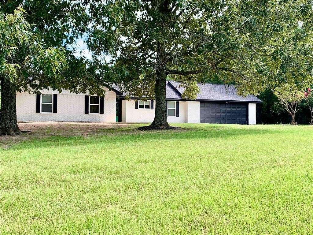 5 Acres of Residential Land with Home for Sale in Beckville, Texas
