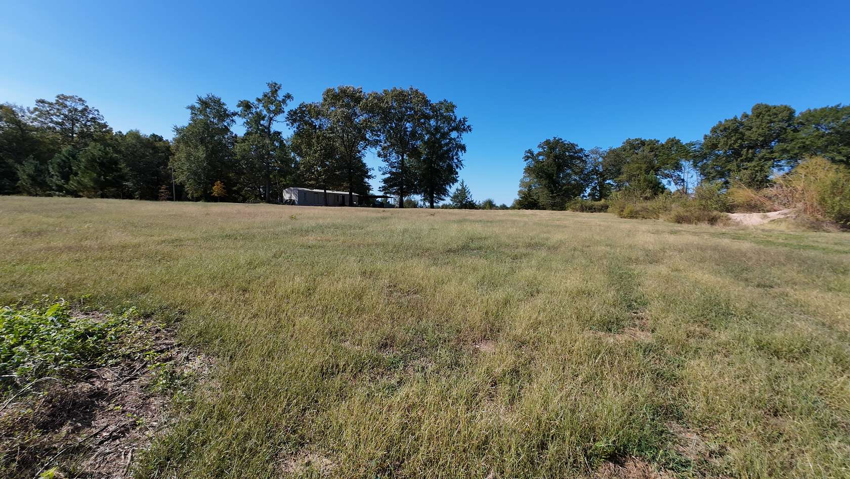 10 Acres of Land with Home for Sale in Atlanta, Texas