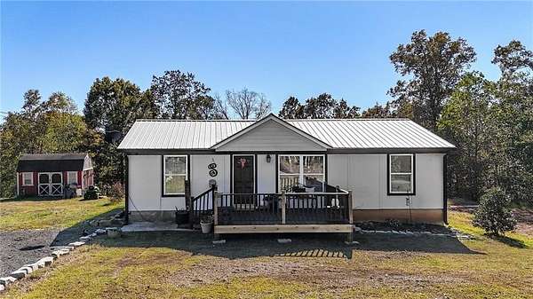 2.19 Acres of Residential Land with Home for Sale in Ball Ground, Georgia