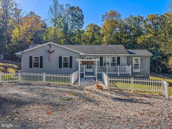 5 Acres of Residential Land with Home for Sale in Great Cacapon, West Virginia