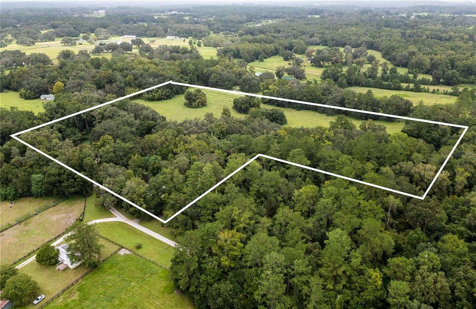 24.3 Acres of Land with Home for Sale in Reddick, Florida