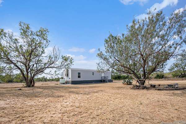 8 Acres of Residential Land with Home for Sale in Yancey, Texas