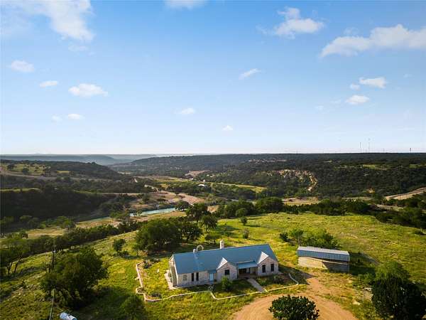 10 Acres of Residential Land with Home for Sale in Junction, Texas