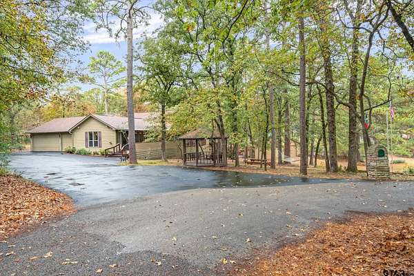 1.5 Acres of Residential Land with Home for Sale in Holly Lake Ranch, Texas