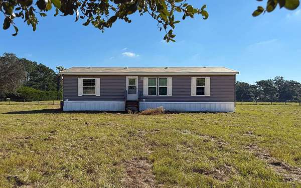 9.73 Acres of Land with Home for Sale in Chiefland, Florida