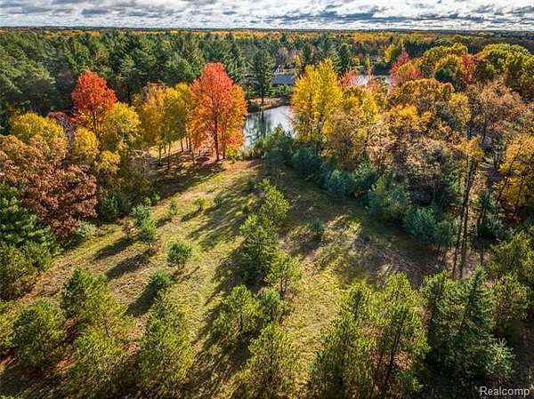 0.7 Acres of Residential Land for Sale in Canadian Lakes, Michigan