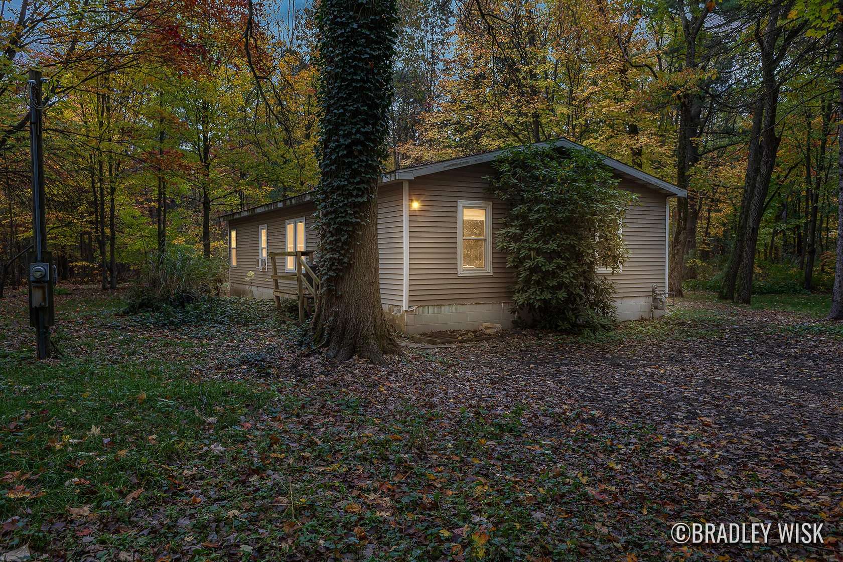 2.5 Acres of Residential Land with Home for Sale in West Olive, Michigan