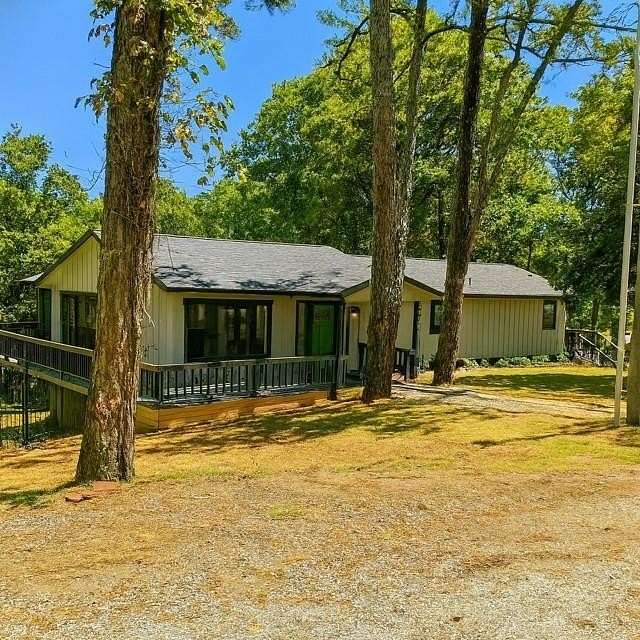 12 Acres of Recreational Land with Home for Sale in Rogers, Arkansas