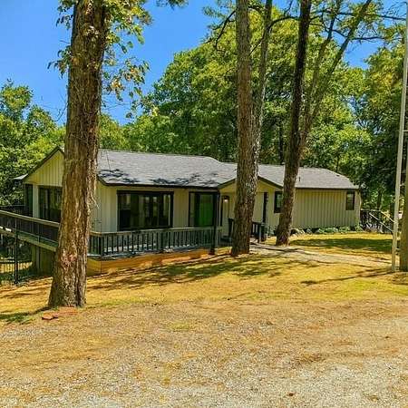 12 Acres of Recreational Land with Home for Sale in Rogers, Arkansas