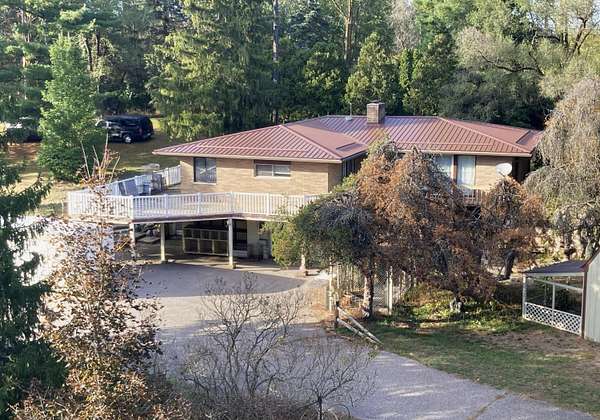 11 Acres of Land with Home for Auction in Sheridan, Michigan