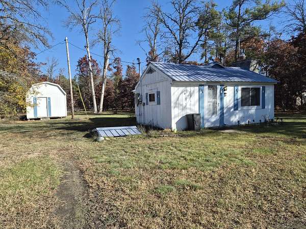 0.5 Acres of Residential Land with Home for Sale in Grayling, Michigan