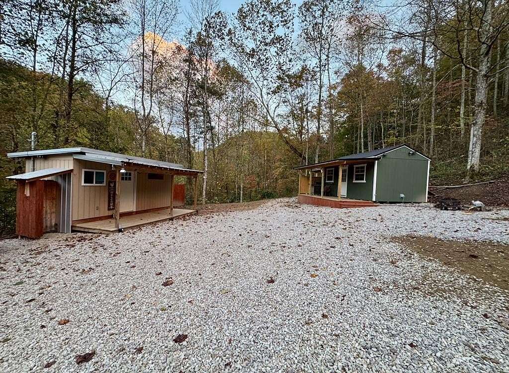 14.4 Acres of Land with Home for Sale in Blaine, Kentucky