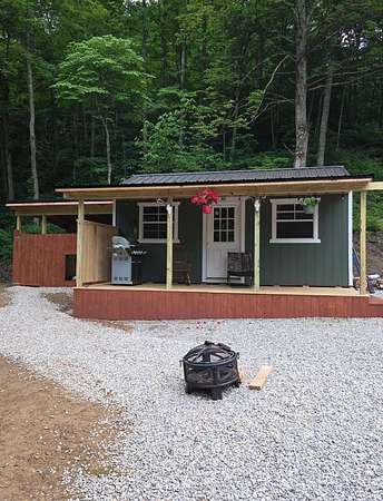 14.4 Acres of Land with Home for Sale in Blaine, Kentucky