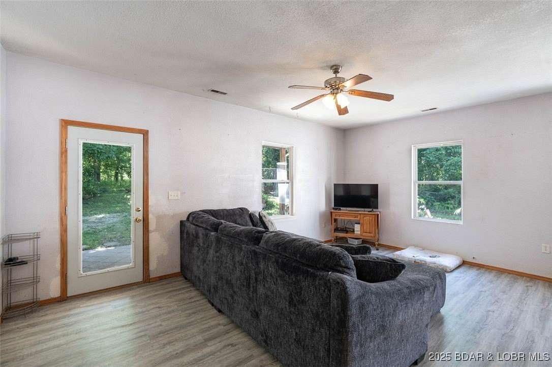 5.59 Acres of Residential Land with Home for Sale in Gravois Mills, Missouri