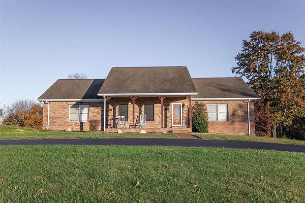 7.6 Acres of Land with Home for Sale in Scottsville, Kentucky