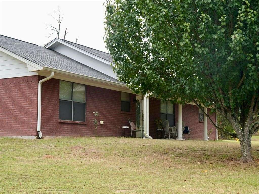 6.2 Acres of Residential Land with Home for Sale in Hughes Springs, Texas