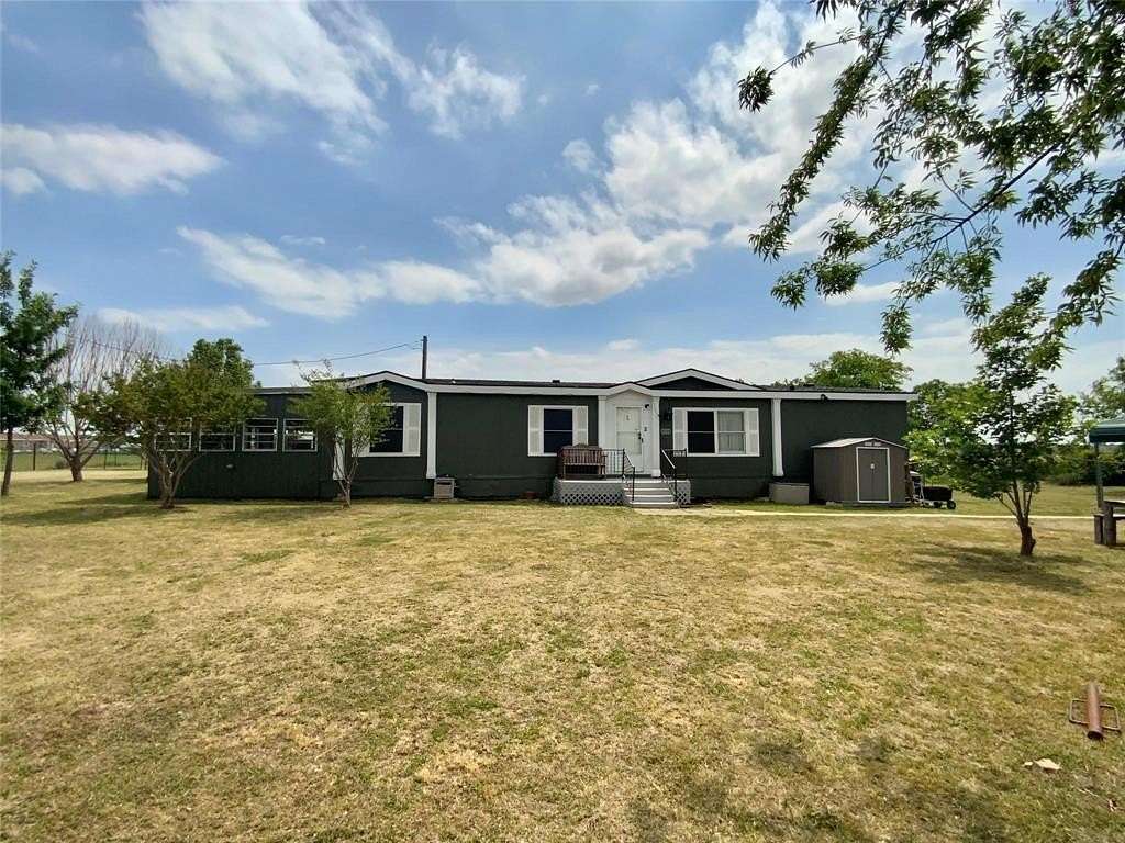 2.5 Acres of Residential Land with Home for Lease in Justin, Texas