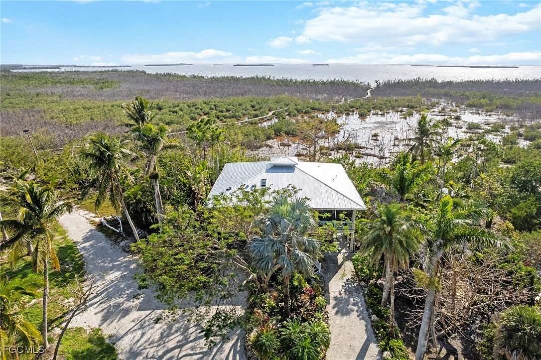 25 Acres of Land with Home for Sale in Bokeelia, Florida