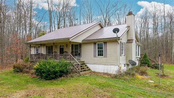 3 Acres of Residential Land with Home for Auction in Rock Creek, Ohio