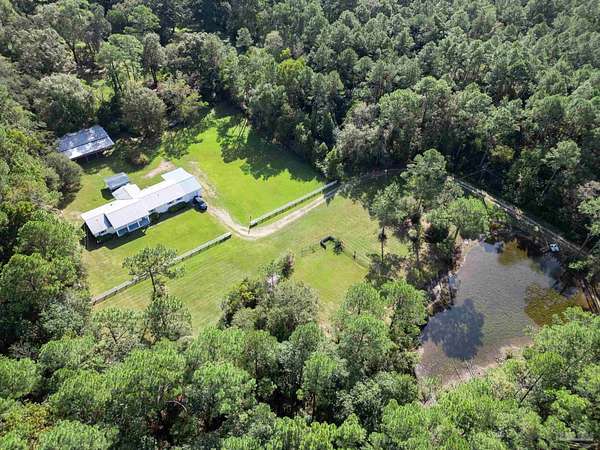 9.39 Acres of Land with Home for Sale in Cantonment, Florida