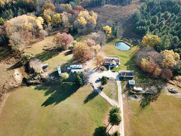 18 Acres of Land with Home for Sale in Whittemore, Michigan