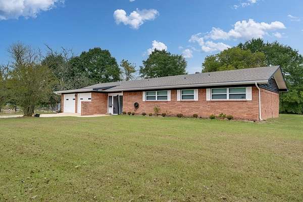 1.89 Acres of Land with Home for Sale in Elkhart, Texas