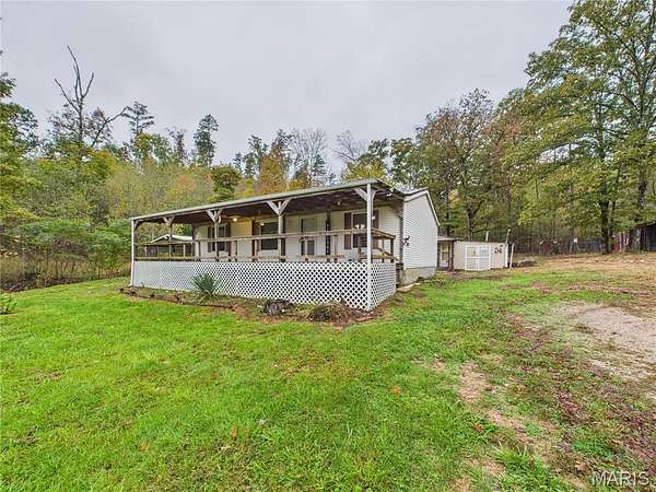 7.47 Acres of Residential Land with Home for Sale in Williamsville, Missouri