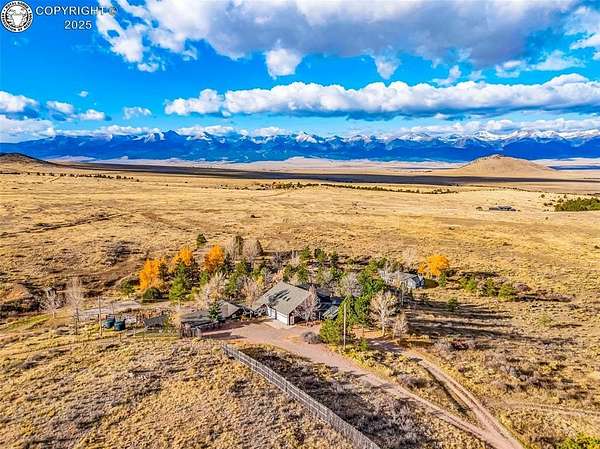 214 Acres of Recreational Land with Home for Auction in Westcliffe, Colorado