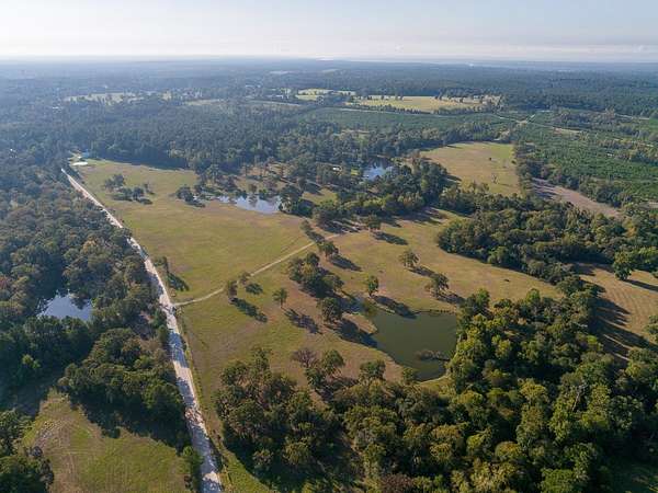 100 Acres of Agricultural Land with Home for Sale in Trinity, Texas