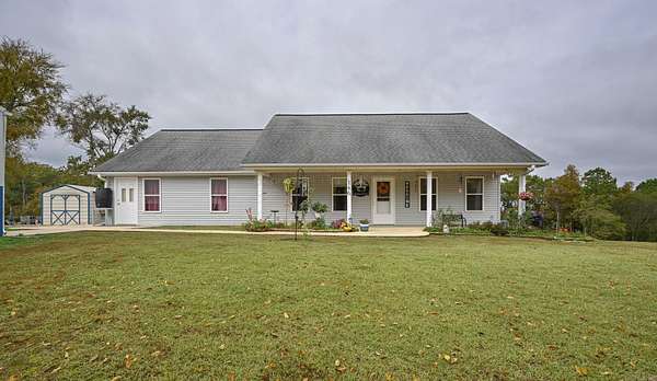 7.48 Acres of Land with Home for Sale in Mena, Arkansas