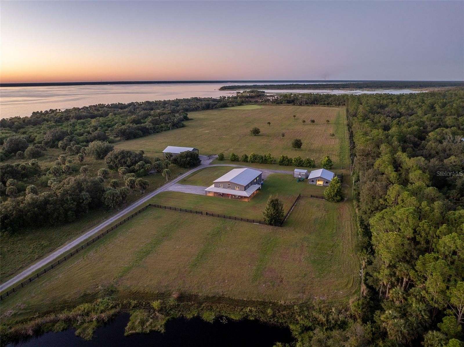 44.1 Acres of Agricultural Land with Home for Sale in Mims, Florida