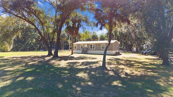 3 Acres of Residential Land with Home for Sale in Weirsdale, Florida