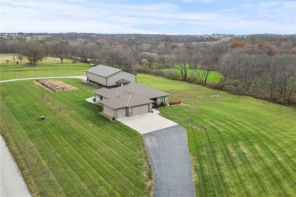 61.8 Acres of Agricultural Land with Home for Sale in Smithville, Missouri