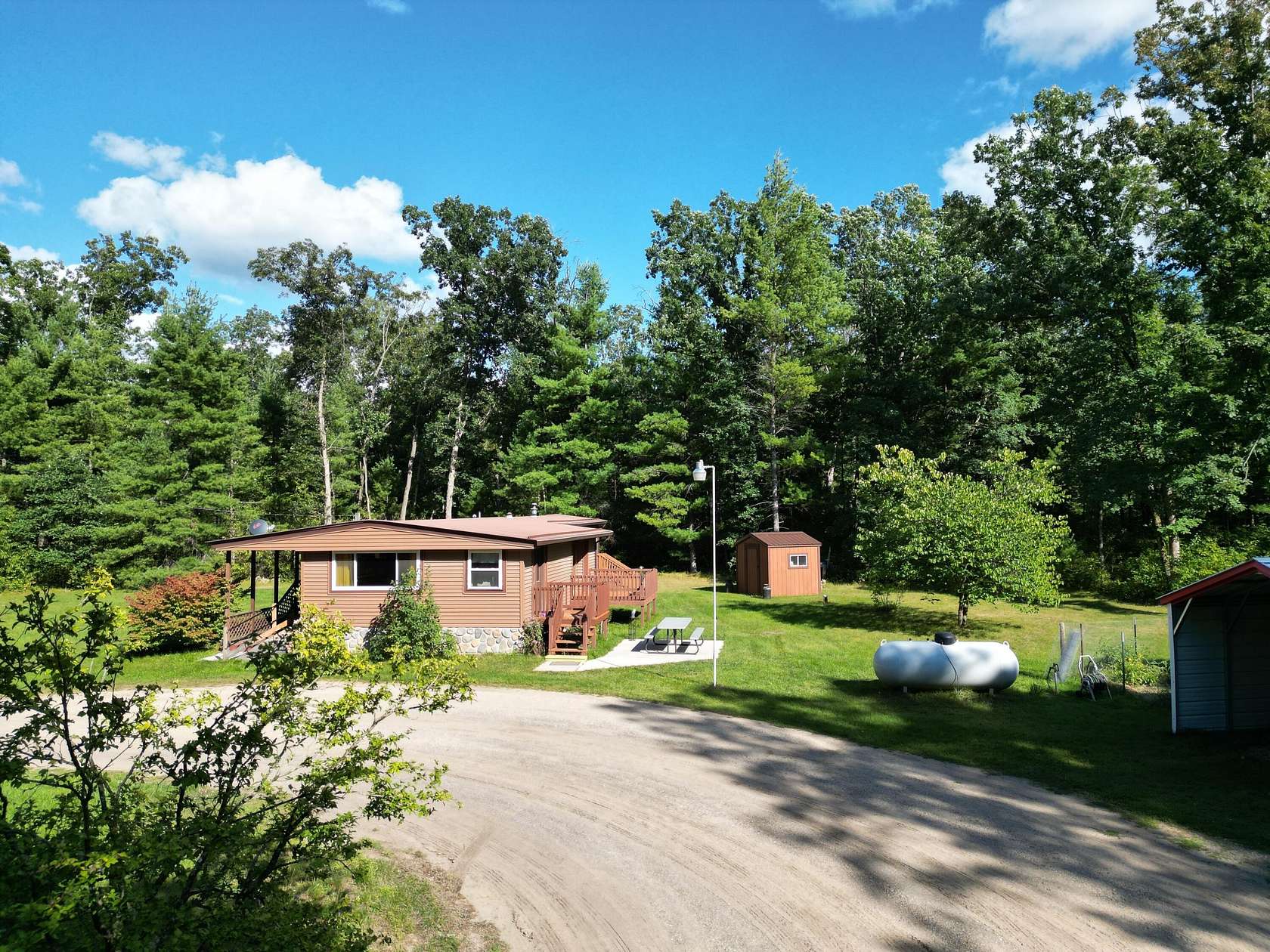 5.54 Acres of Residential Land with Home for Sale in Howard City, Michigan