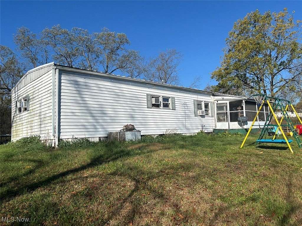 5 Acres of Residential Land with Home for Auction in Malvern, Ohio