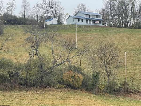 14.4 Acres of Land with Home for Sale in Volga, West Virginia