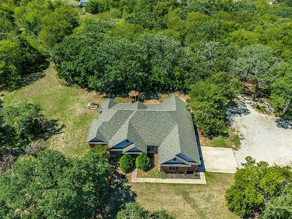 5.84 Acres of Residential Land with Home for Lease in Pilot Point, Texas