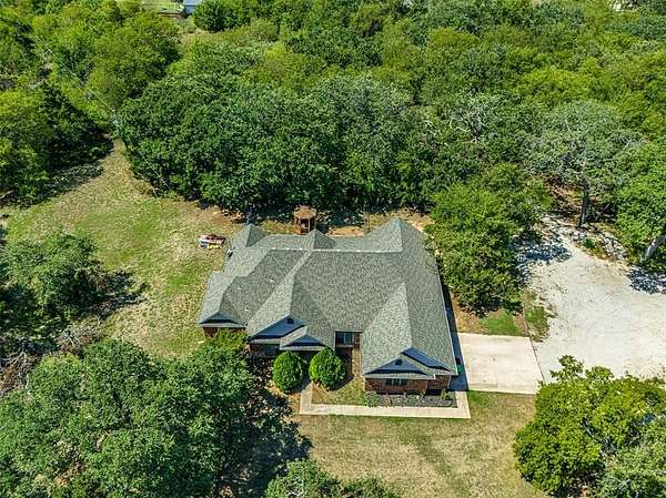 5.84 Acres of Residential Land with Home for Lease in Pilot Point, Texas