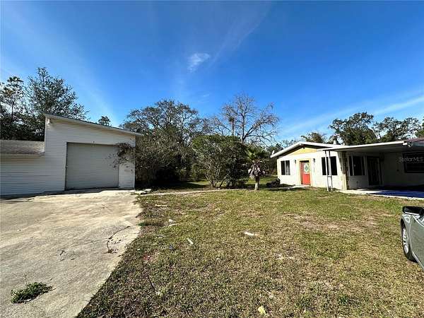 1.8 Acres of Residential Land with Home for Sale in Spring Hill, Florida