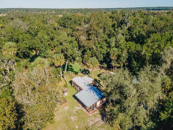 3 Acres of Residential Land with Home for Sale in Citra, Florida