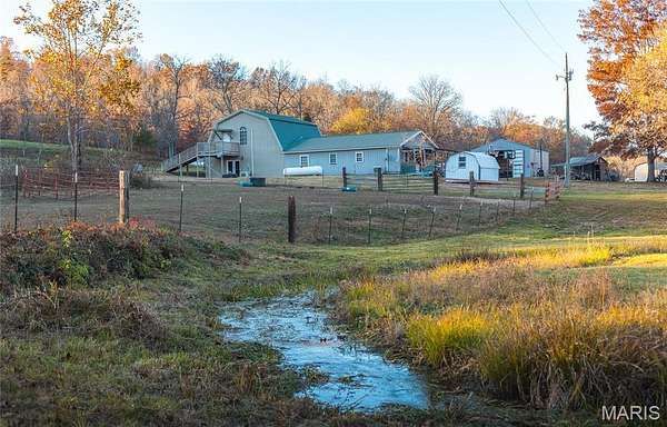 80 Acres of Agricultural Land with Home for Sale in Bunker, Missouri