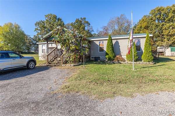 7 Acres of Land with Home for Sale in Harviell, Missouri