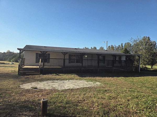 1.67 Acres of Residential Land with Home for Sale in Madisonville, Tennessee